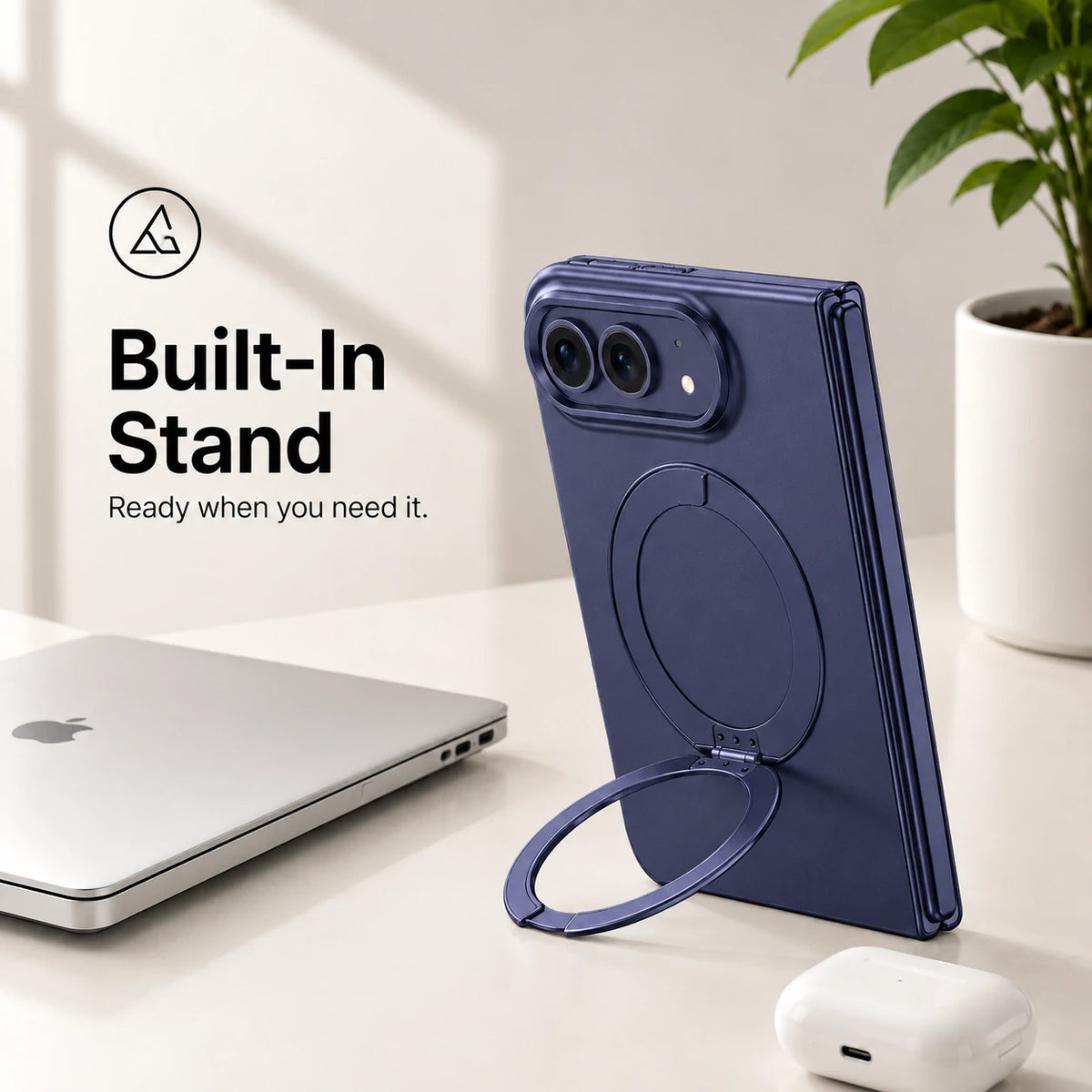 Navy blue folding phone case standing upright with its circular built-in stand on a desk #color_Deep Blue